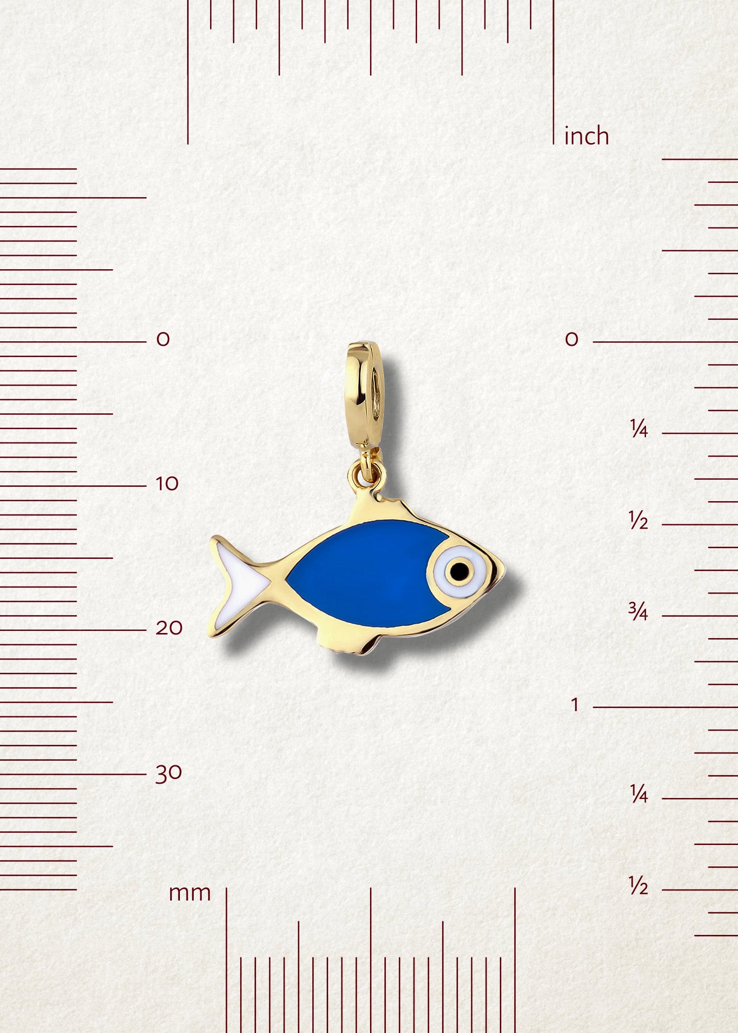 Measurement view of Fishy Wishes Charm by whywhy NYC, 14K gold and enamel fish charm, approx. 21mm length.