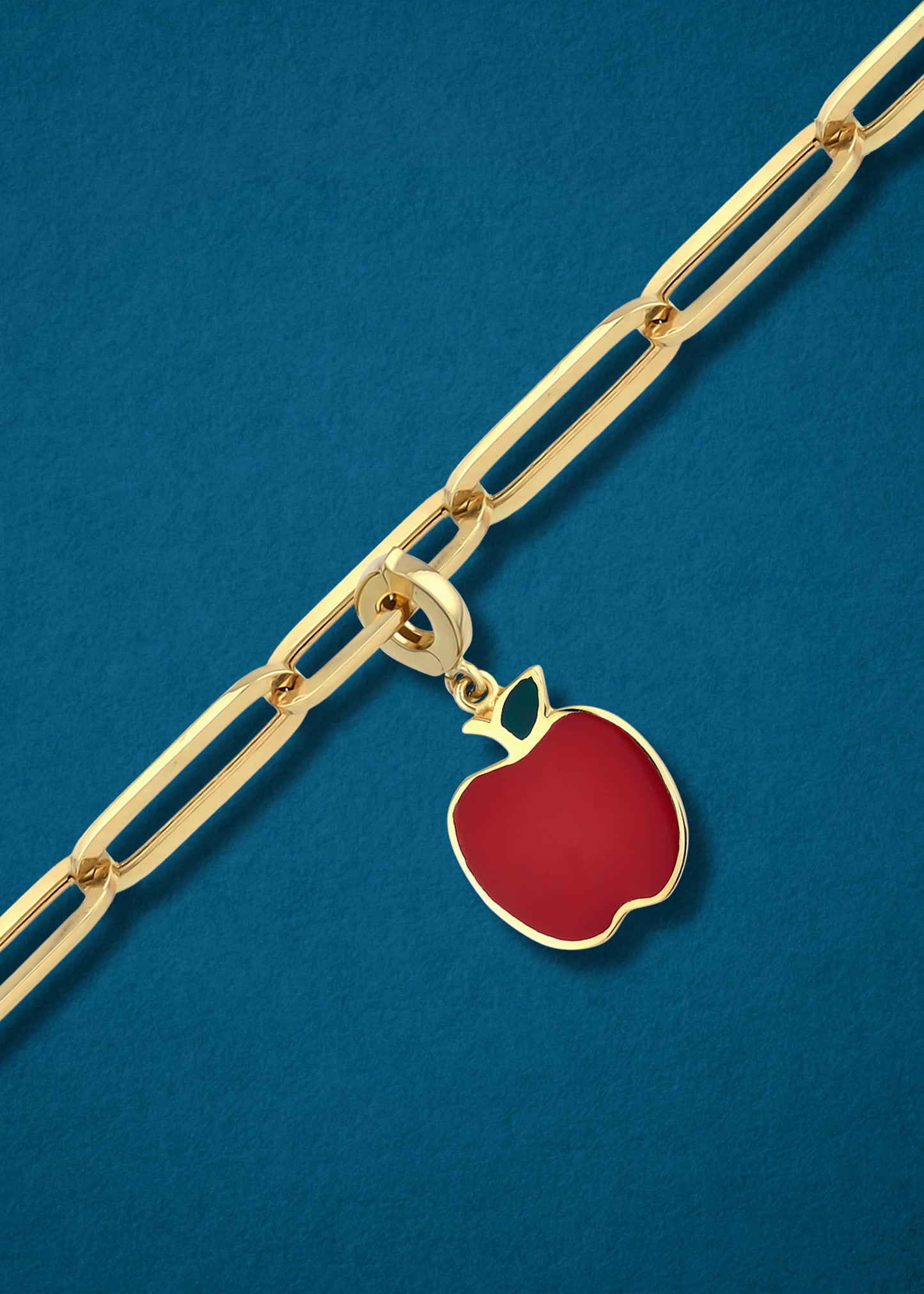 Golden Apple of NYC Charm in 14K gold on a gold chain, iconic apple charm necklace by whywhy NYC.