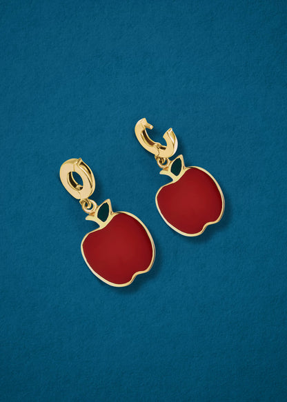 Golden Apple Charm showing both open and closed views of the 14K solid gold clip, with deep red enamel, displayed on a blue background.